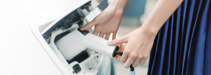 lady hand charge electric power ev car in hi technology transportation in future. Easy to use in technology concept.